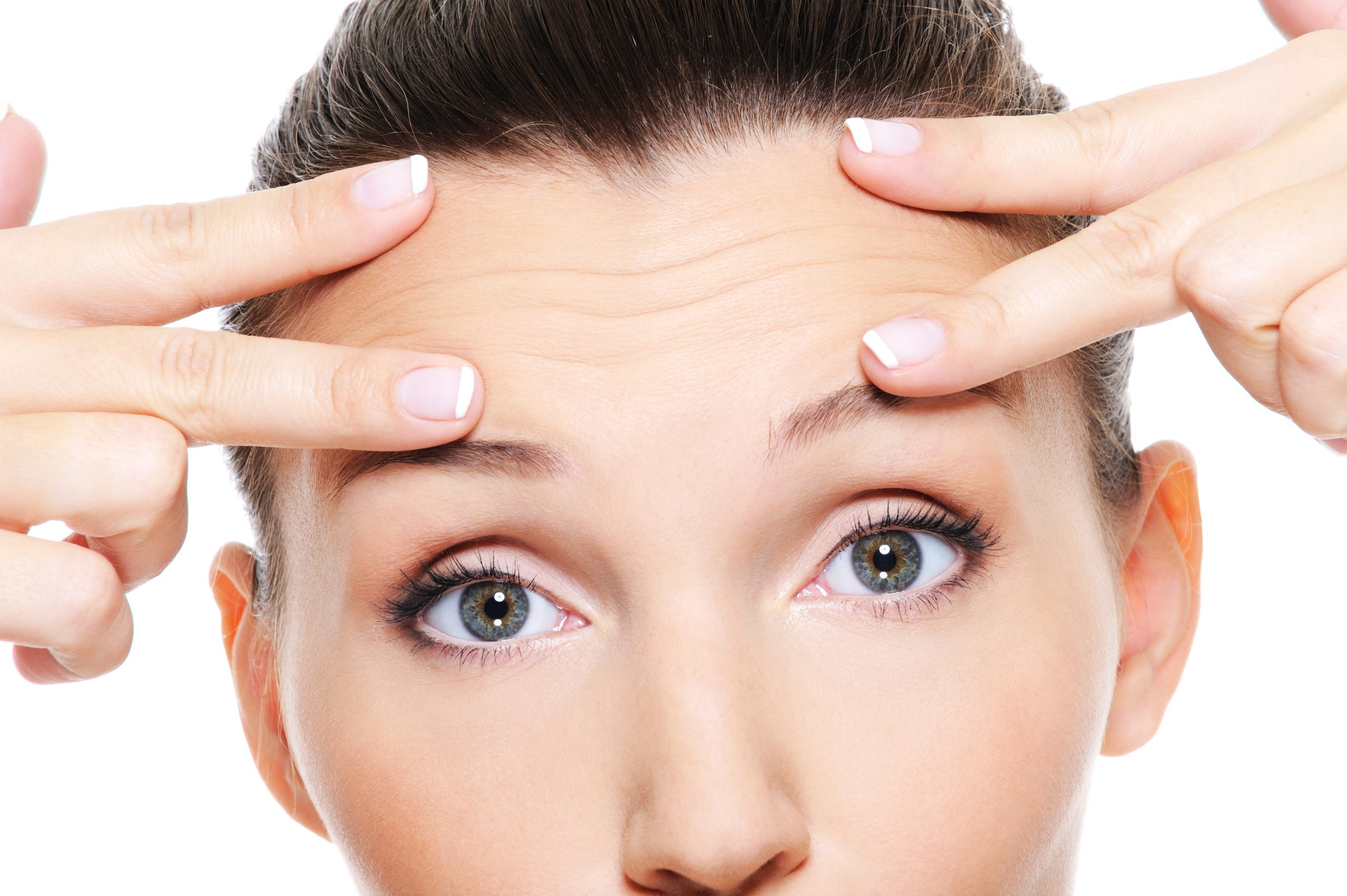 Female face with wrinkles on forehead - skincare treatment